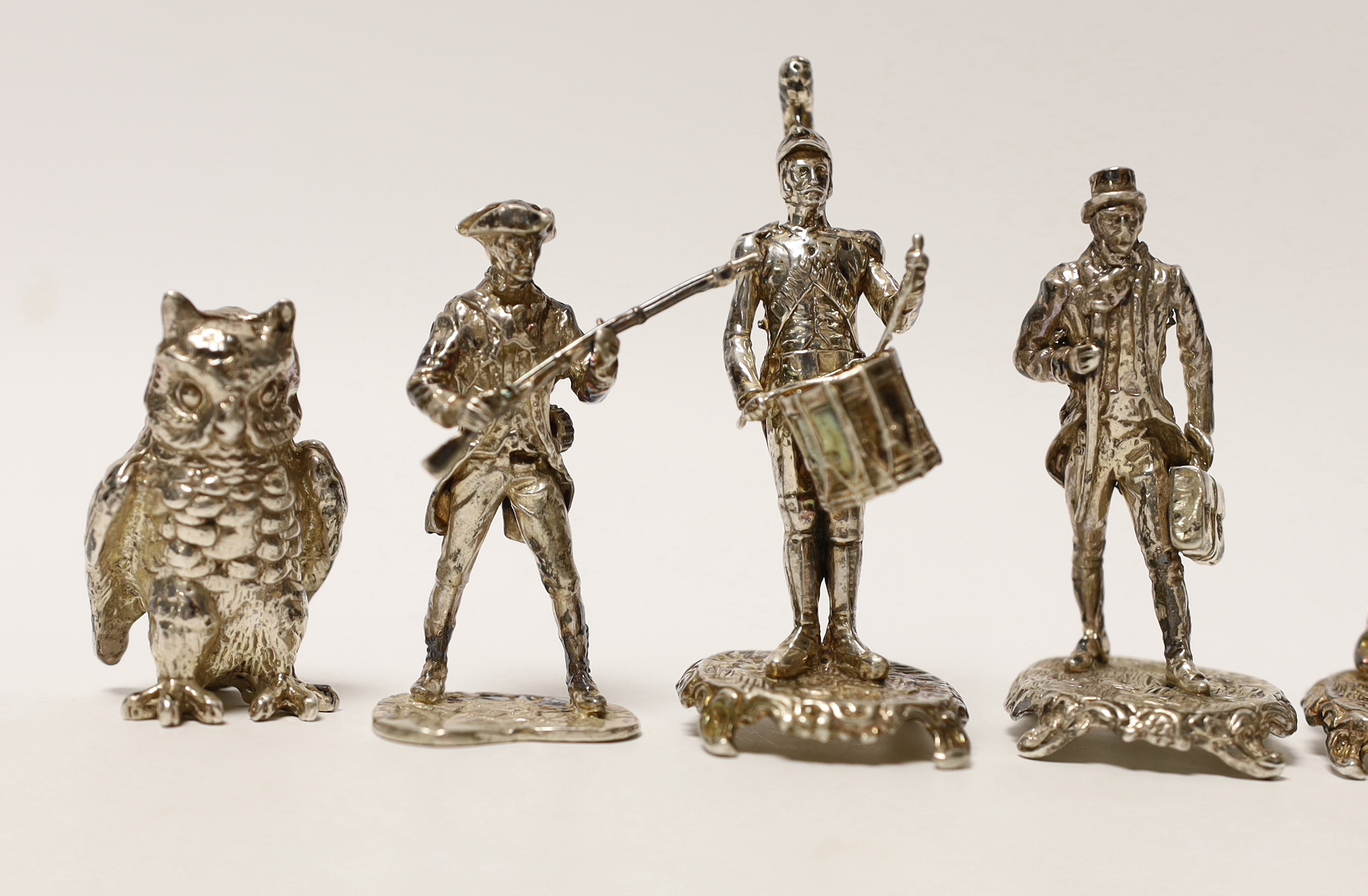 A set of five miniature silver model soldiers, maker SMC, London, 1975, tallest 75mm, together with a silver miniature model of an awl, same date and maker.